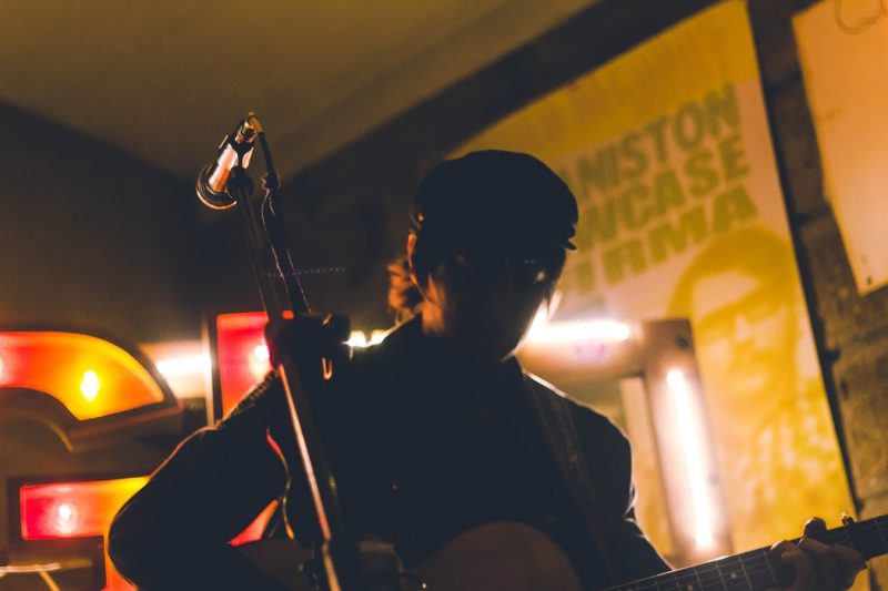 Musician playing in a venue