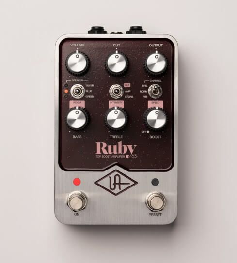 The Ruby '63 Top Boost Amplifier UAFX guitar amp emulator emulates the sound that brought us bands like The Queen and Radiohead. The speaker toggle offers different options to the Ruby with Silver, Blue and Green options. Finally, the parameters include Volume, Cut, Output, Bass, Treble and Boost.
